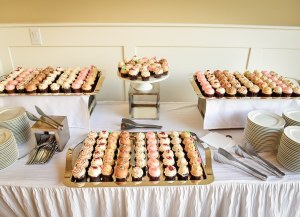 display of a bazillion mini cupcakes in assorted flavors.