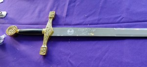 sword engraved with crest and our names.
